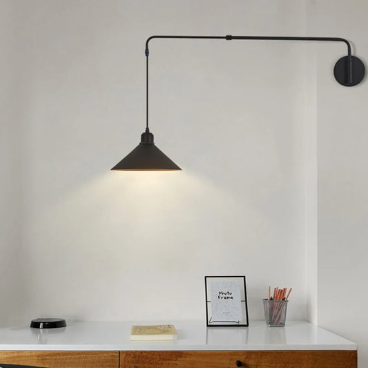 Black wall sconce light fixtures in matte iron finish for minimalist interiors.