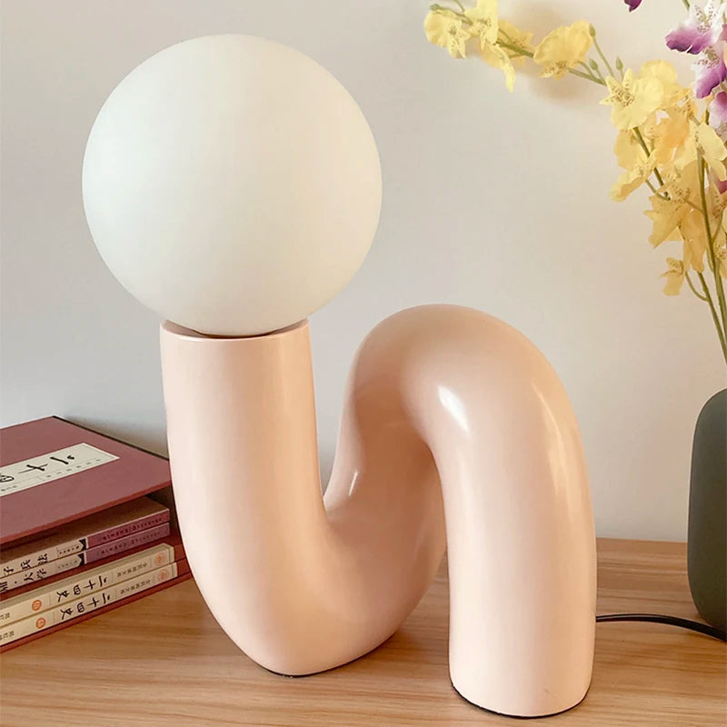 Close-up of Soma resin lamp base with matte finish and warm glow