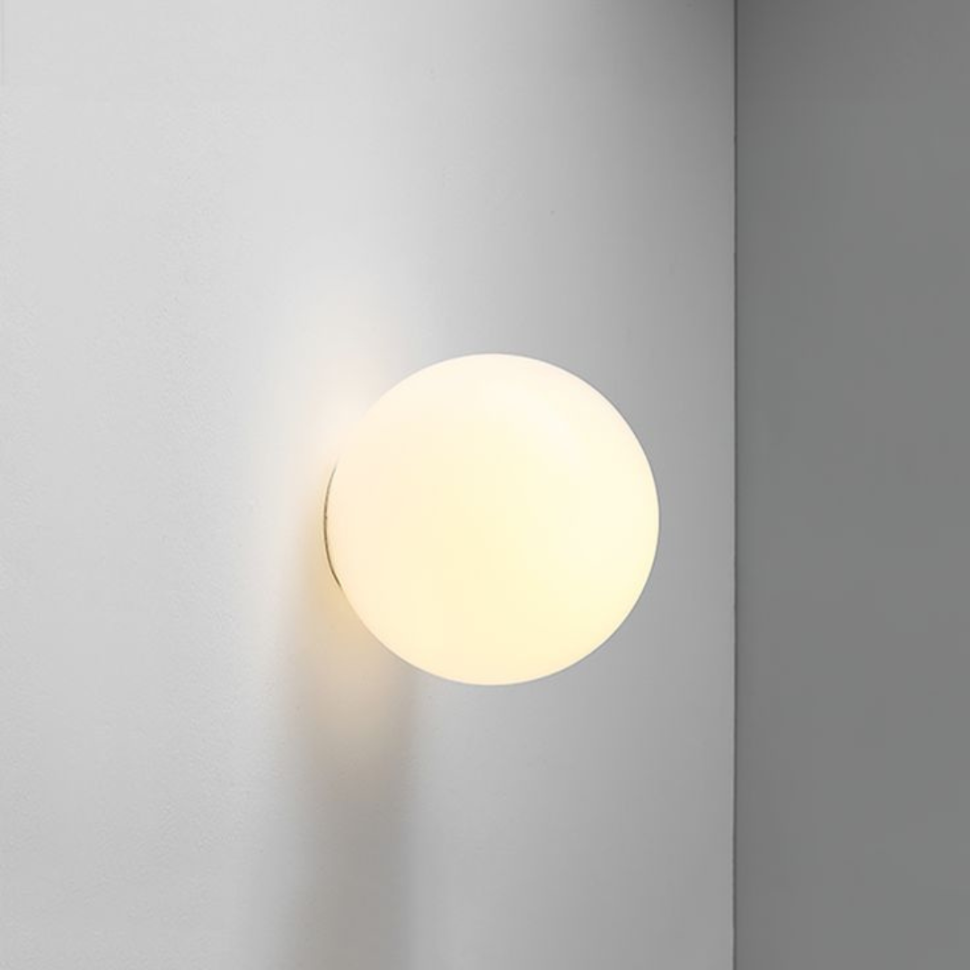 Round wall light fixture on a gray wall