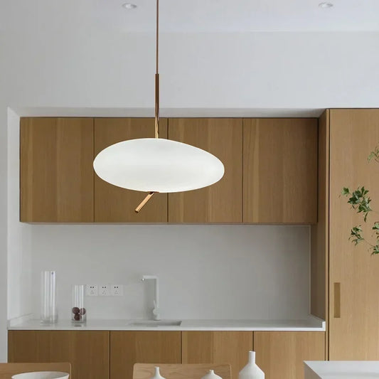 Dimmable pendant lights in a master bedroom for adjustable bedside ambiance.