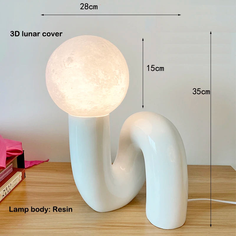 Elegant reading nook with Soma resin desk lamp – modern interior lighting
