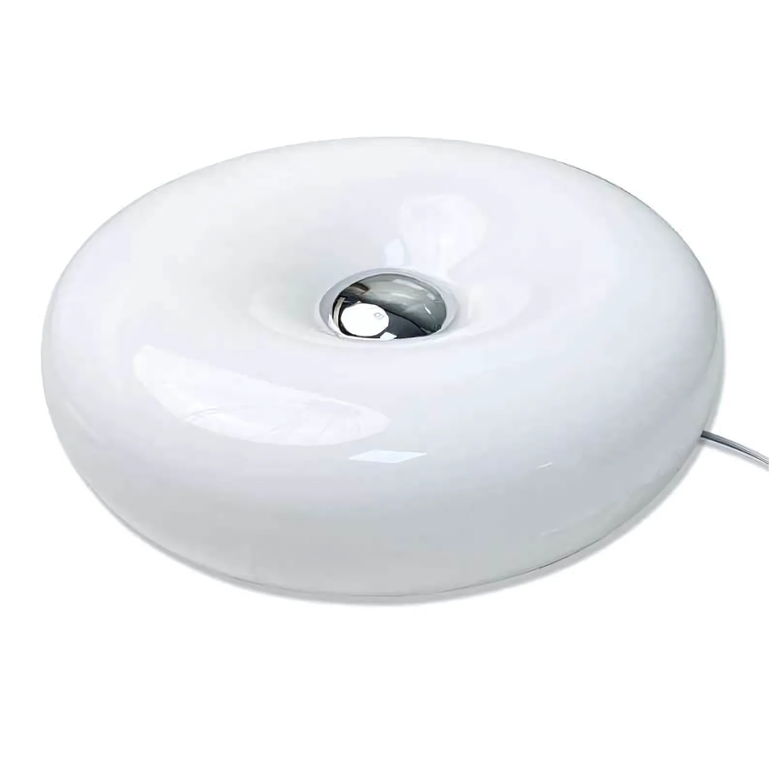 Iconic LED donut lamp on modern desk with touch-sensitive brightness control”
