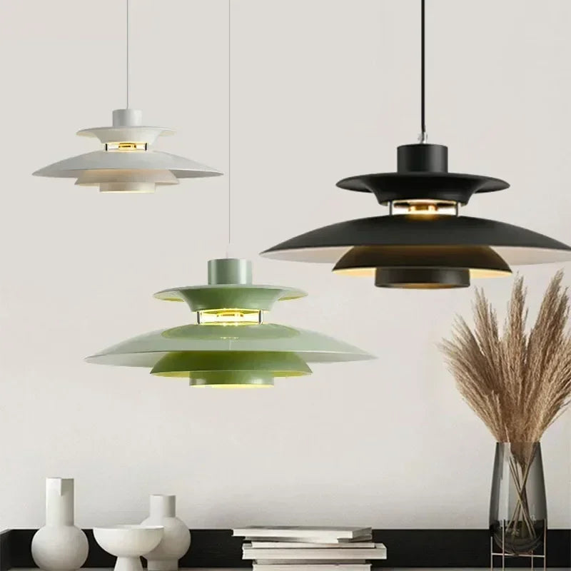Modern gold glass pendant light hanging in dining room