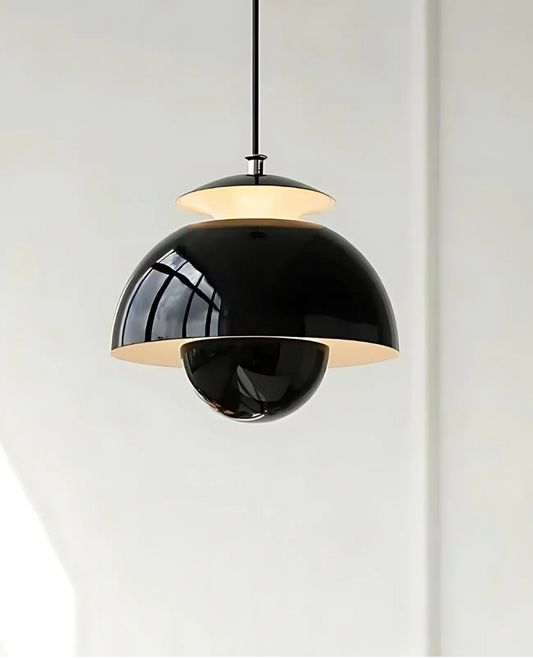 Modern pendant light with black and gold design on a white background