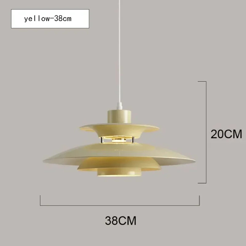 Gold pendant light with dimensions on a gray background