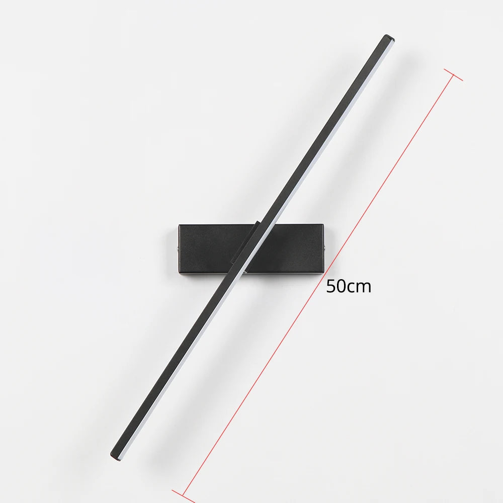 Black rectangular light fixture with a long black arm on a white background, showing measurement details.