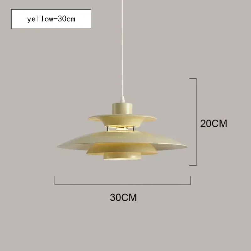 Gold pendant light with dimensions on a gray background