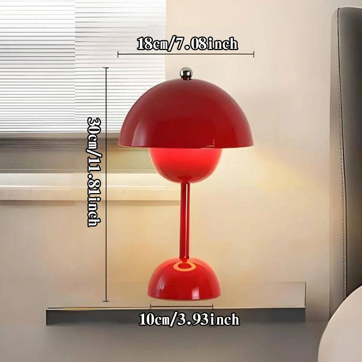 Red table lamp with dimensions displayed on a neutral background