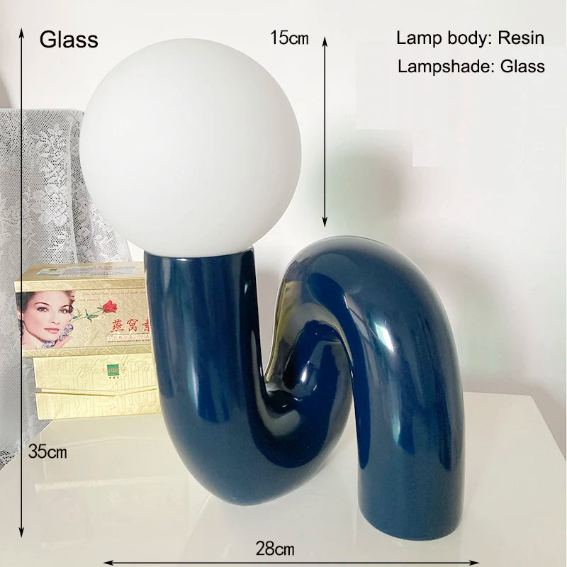 Top view of Soma resin lamp on writing desk – Nordic minimalism