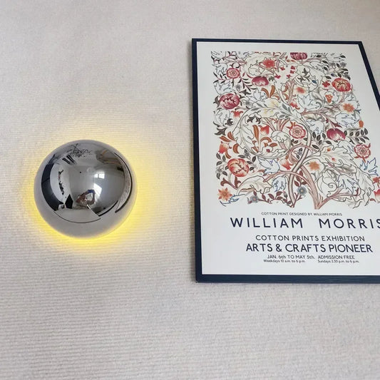 Turbine design wall sconce in polished silver finish for industrial chic home decor.