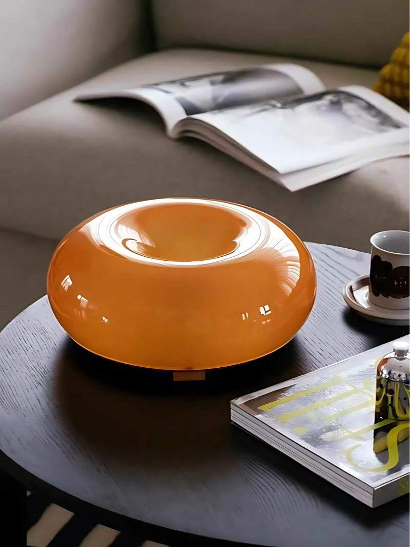 Viral IKEA-style donut lamp glowing in warm white light on bedside table setup