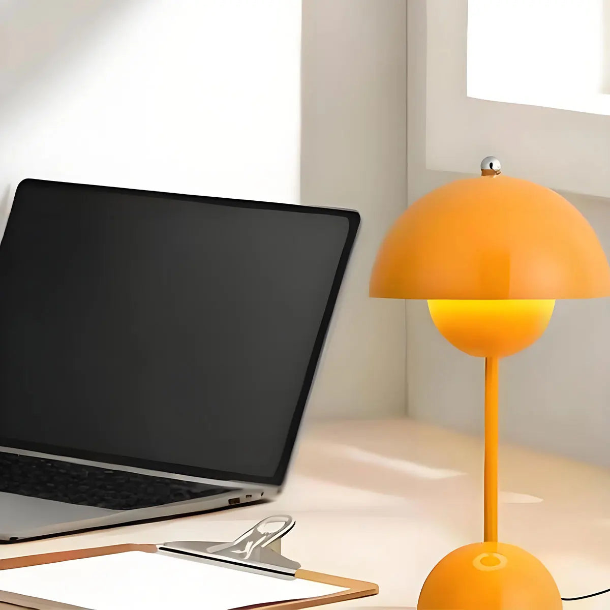 Warm dimmable glow from Nordic style bedside lamp in cozy bedroom