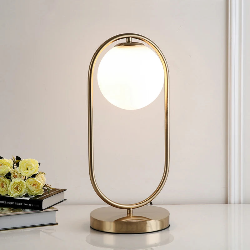 chaitra frosted glass table lamp with gold accents