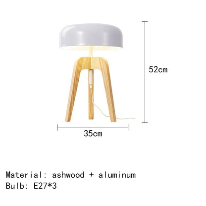 Art deco inspired tripod table lamp with natural bamboo textures and button switch.