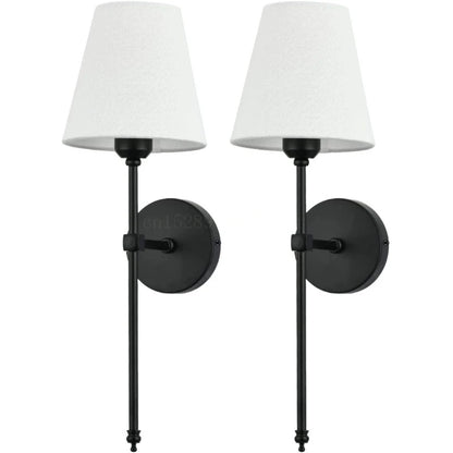 Bedroom wall sconce lights with a soft beige lampshade for a cozy bedside glow.