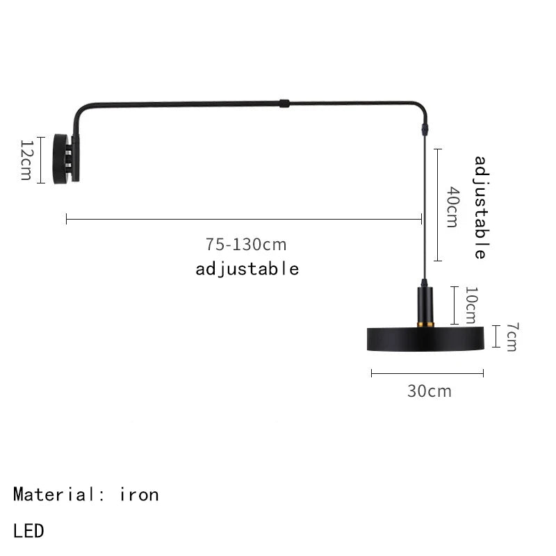 Bedside reading light with black metal body and adjustable long arm.