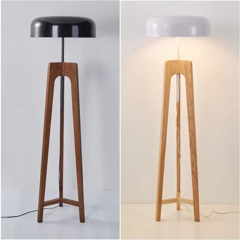 Designer floor light with mushroom-shaped iron shade in a minimalist master bedroom.