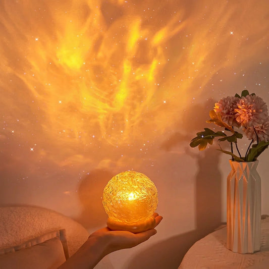 Crystal mood lamp casting sunset light on wall