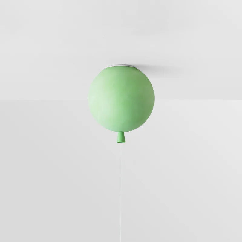 Green balloon-inspired ceiling lamp providing soft LED light for play areas.