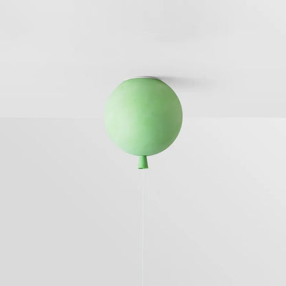 Green balloon-inspired ceiling lamp providing soft LED light for play areas.