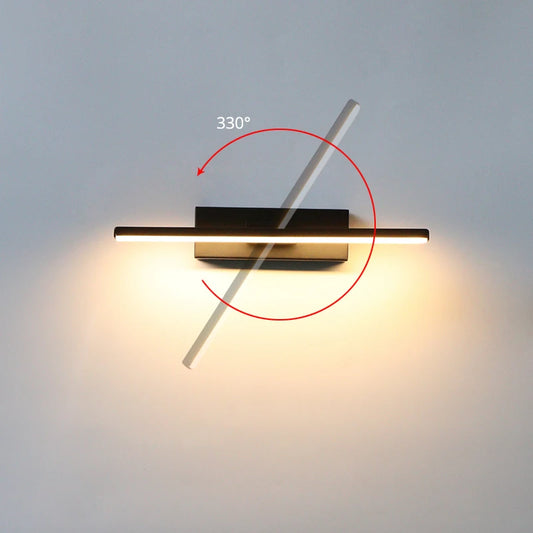 Wall-mounted light fixture with a 330-degree rotation feature on a plain wall.