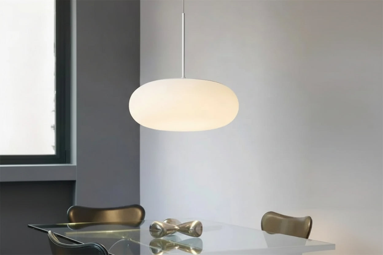 LED Pendant Lighting integrated globe lamp over a minimalist dining table.