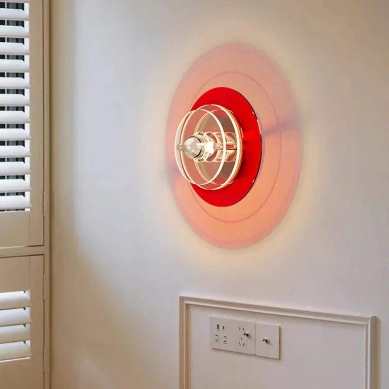 Mid-century modern round wall light in green for a retro-themed study.