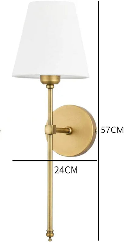 Minimalist fabric wall sconce providing diffused light for a small dining nook.