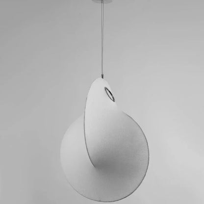 Minimalist pendant lighting for a serene master bedroom with a white silk cloud lamp.