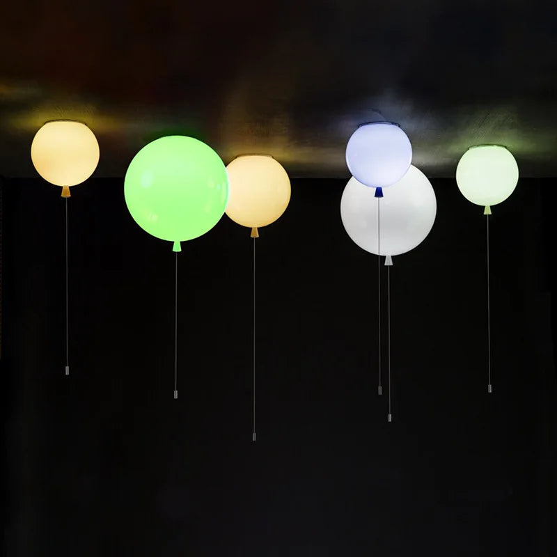 Minimalist pendant lighting for kids rooms with a sleek red acrylic finish.