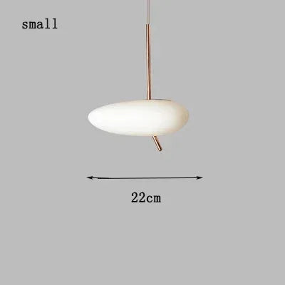 Minimalist pendant lighting in a hotel room for a clean Northern Europe style.