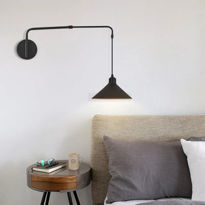 Minimalist wall sconces with scalable extension arm over a modern nightstand.