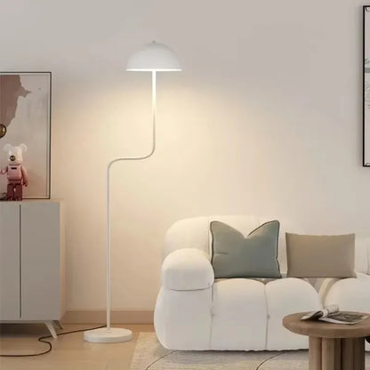 Modern Nordic floor lamps standing in a minimalist kitchen corner.