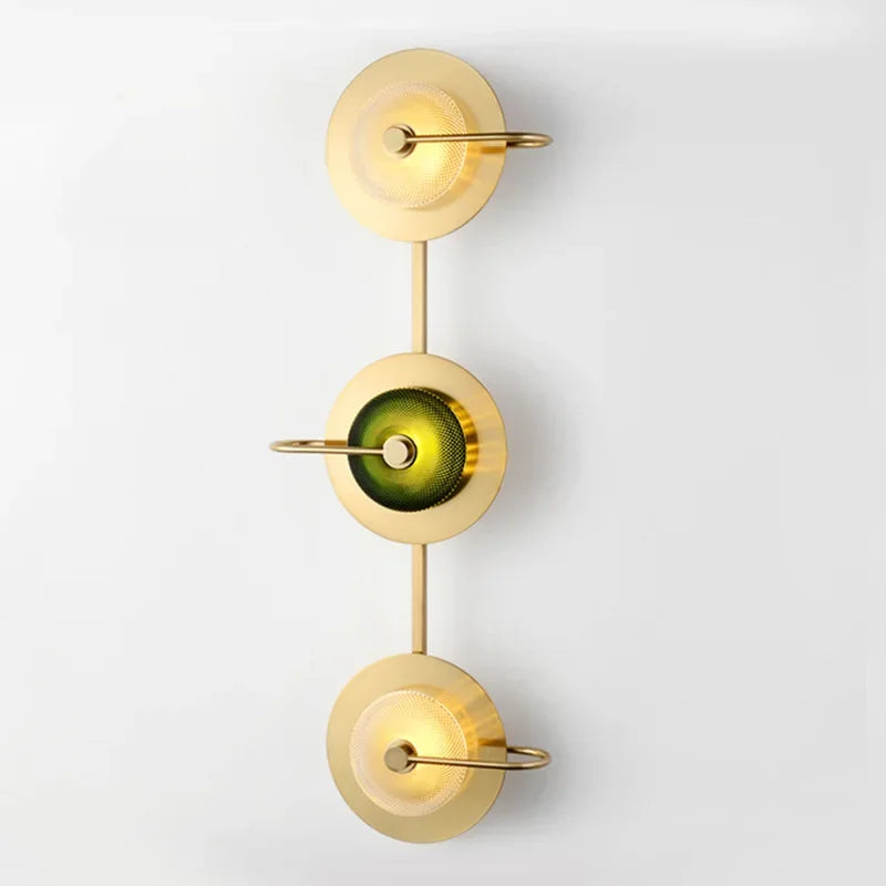 Modern art deco bedside lights in a deep emerald green color.