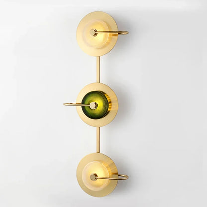 Modern art deco bedside lights in a deep emerald green color.