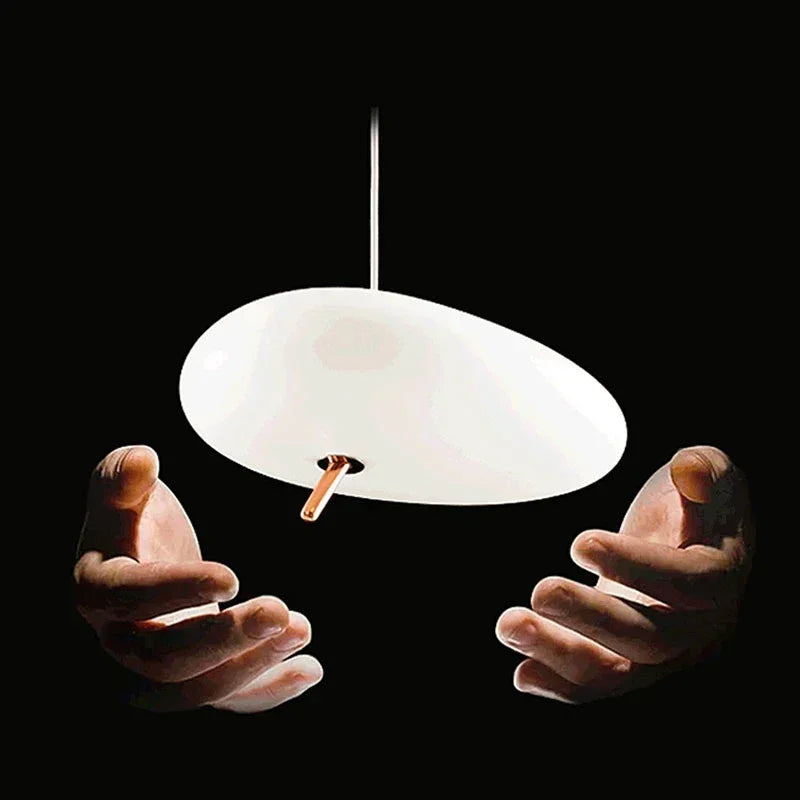 Modern pendant lights with organic river stone shape for minimalist interiors.