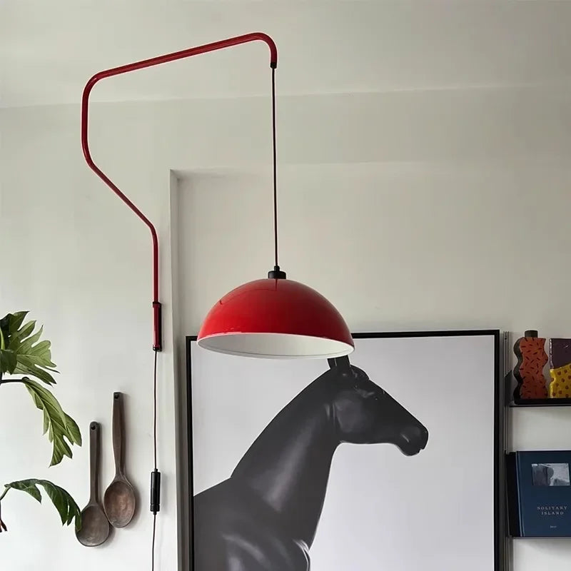 Modern wall sconces with red retractable folding arm for Wabi Sabi living rooms.