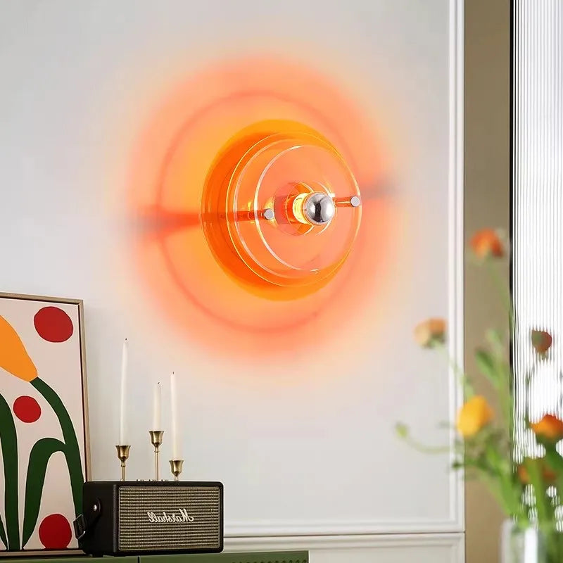 Nordic Bauhaus wall lamps in vibrant orange for a modern living room.