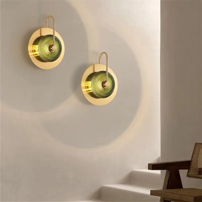 Nordic minimalist crystal sconce featuring a stained glass shade.