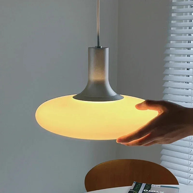 Nordic pendant lights in a master bedroom for soft, diffused evening light.