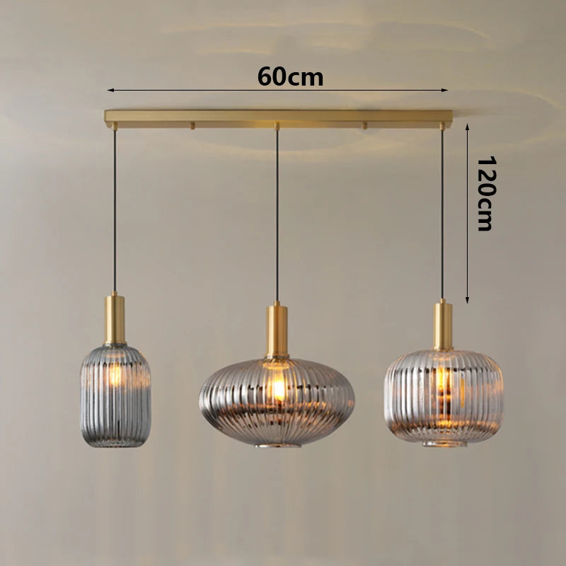 Three pendant lights with measurements on a plain background