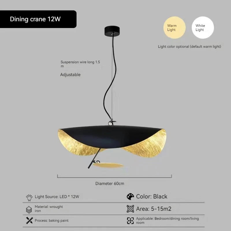 Modern pendant light with black and gold design on a gray background