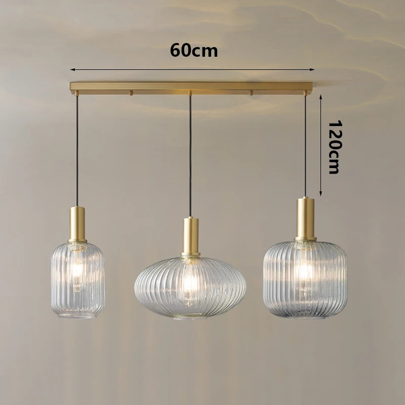 Three pendant lights with dimensions indicated on a plain background