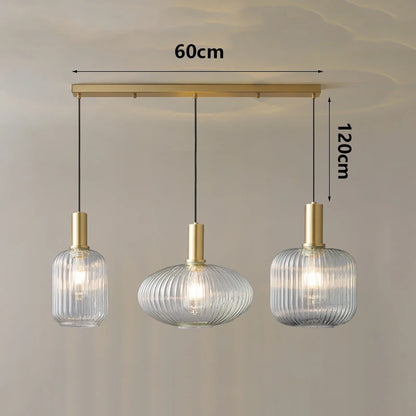 Three pendant lights with dimensions indicated on a plain background