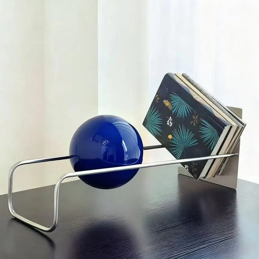Modern metal bookends holding books upright