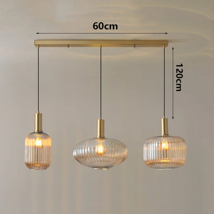 Three pendant lights with measurements on a plain background
