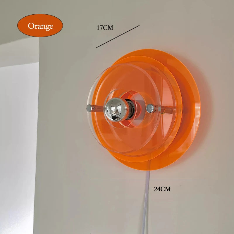 Orange wall light fixture with measurements on a neutral background
