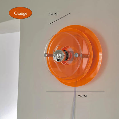 Orange wall light fixture with measurements on a neutral background