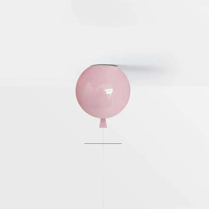 Pink balloon ceiling light with a string on a white background