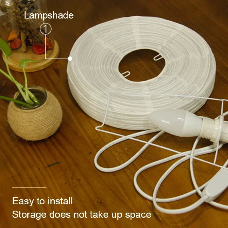Handcrafted rice paper table lamp featuring a soft diffused glow for bedroom relaxation.